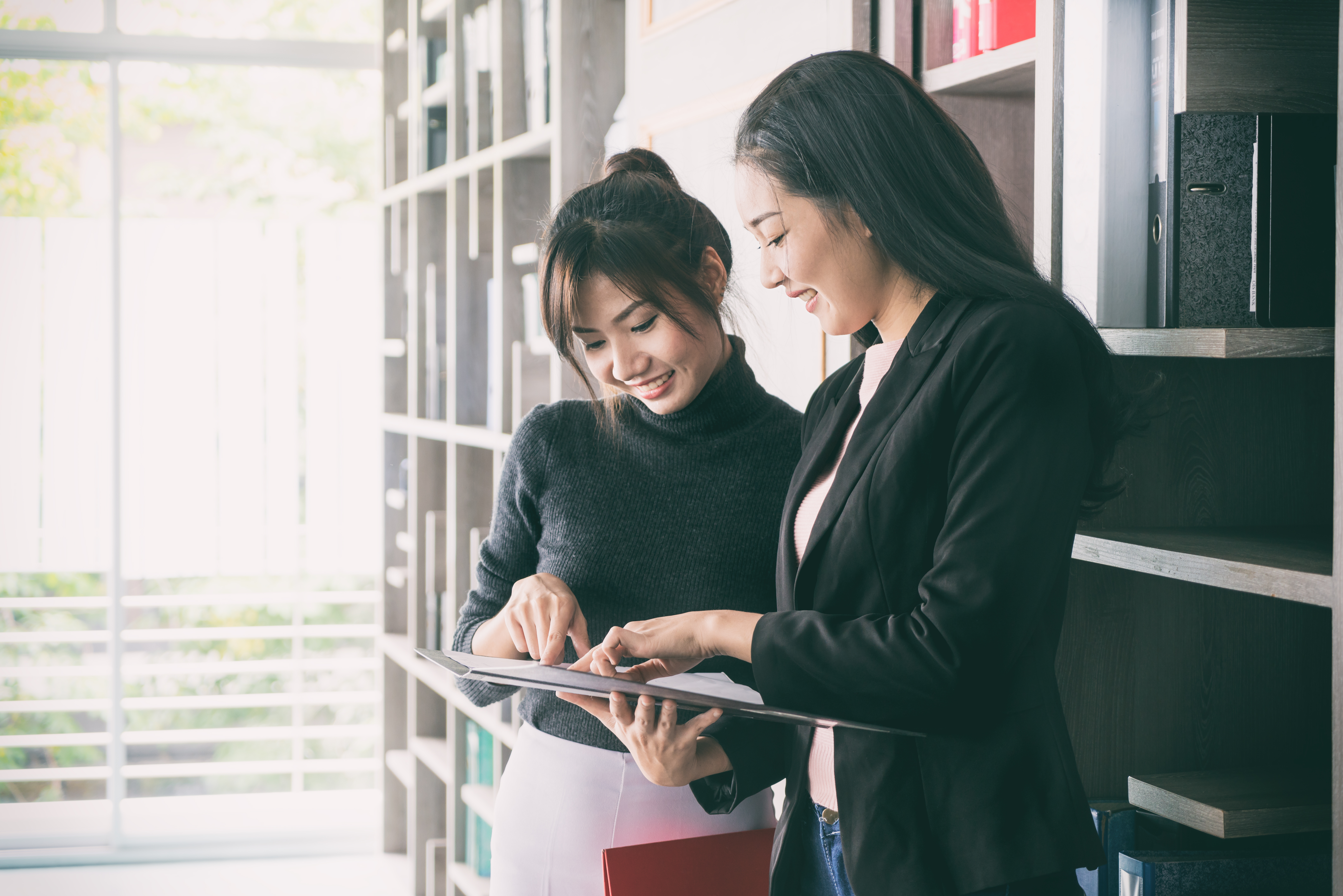 two woman discussing digital life and business coaching